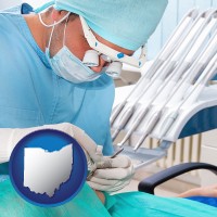 oh map icon and an oral surgeon operating on a dental patient