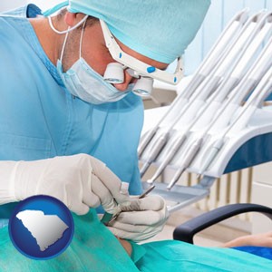 an oral surgeon operating on a dental patient - with South Carolina icon